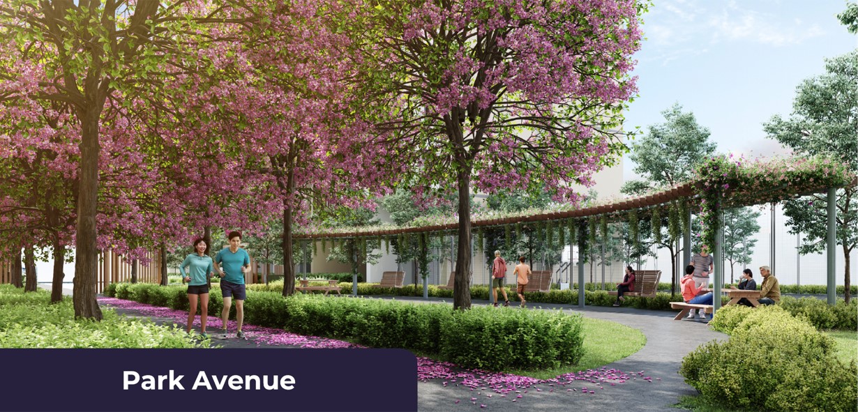 Park Avenue landscaped walkway with flowering trees at Astrum Shah Alam